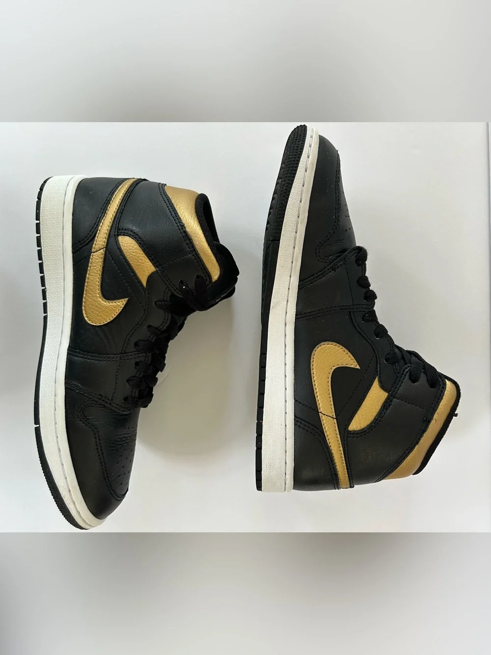 Air Jordan Black and Gold High-Top Sneakers